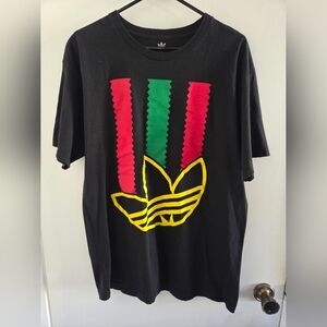 Adidas Men's Black T-Shirt with Red, Green, and Yellow Accents